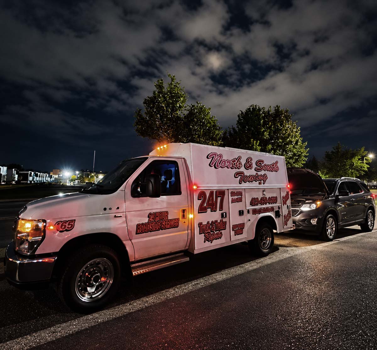 Service Truck in front of SUV providing jumpstart service in Cleveland Tennessee